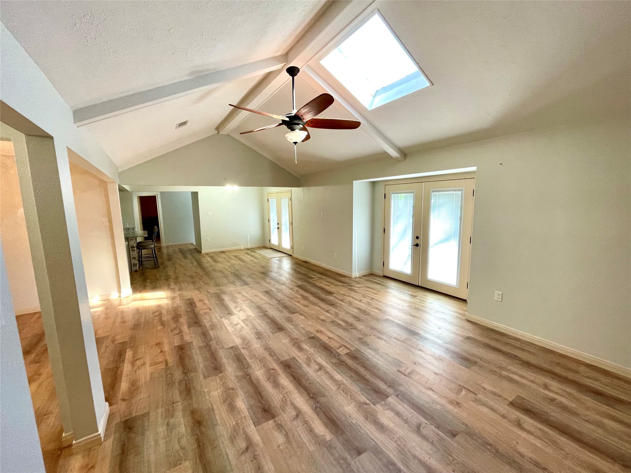 216 Woerner Road Houston, TX 77090 - Photo 11 of 33 a view of a room with wooden floor ceiling fan and window