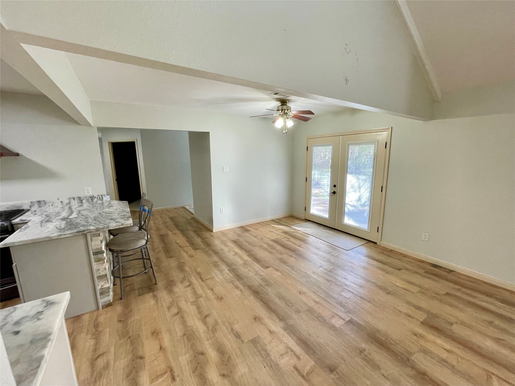 216 Woerner Road Houston, TX 77090 - Photo 12 of 33 a bedroom with a bed and a chandelier