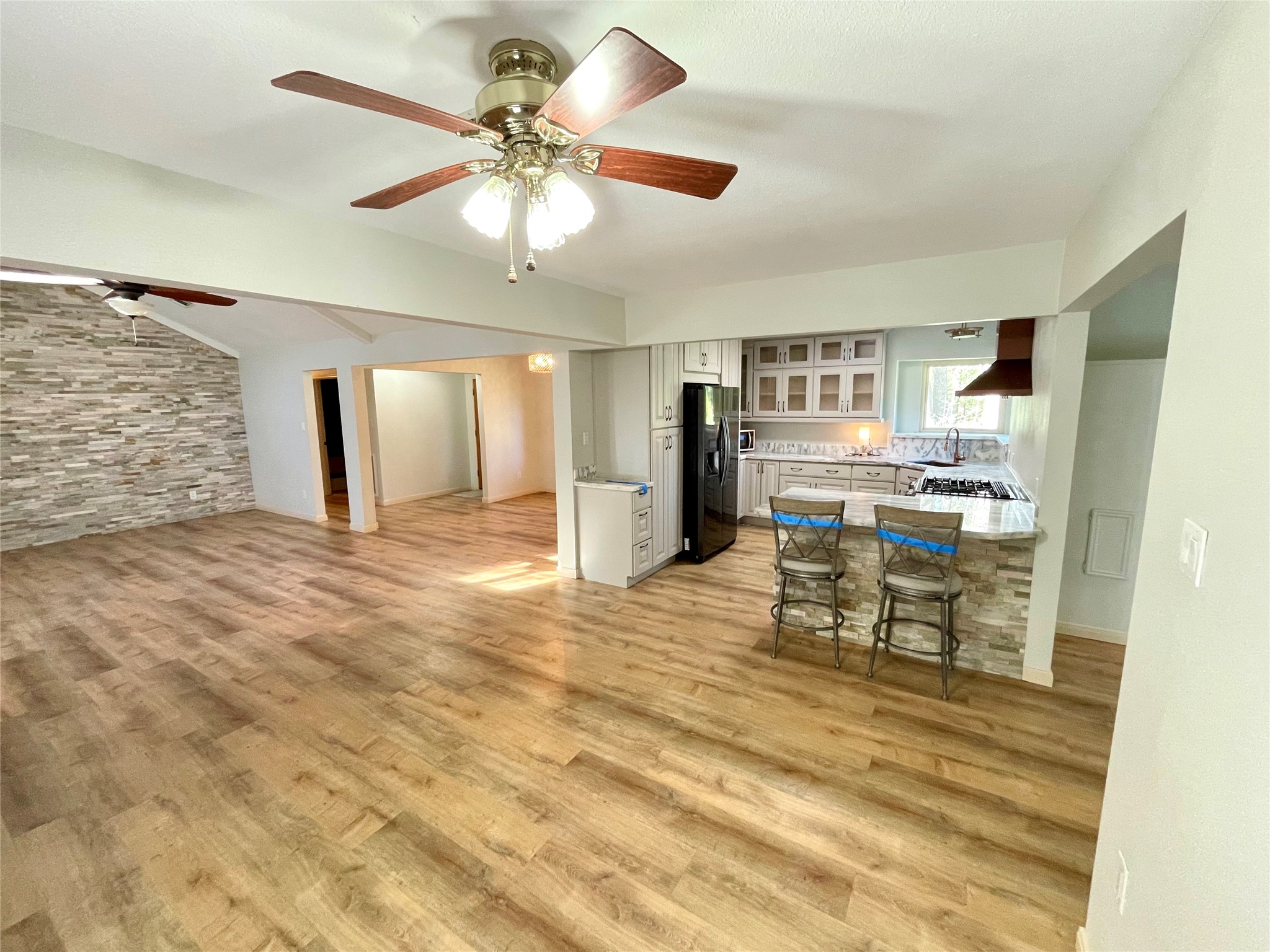 216 Woerner Road Houston, TX 77090 - Photo 17 of 33 a view of a kitchen with furniture and a refrigerator