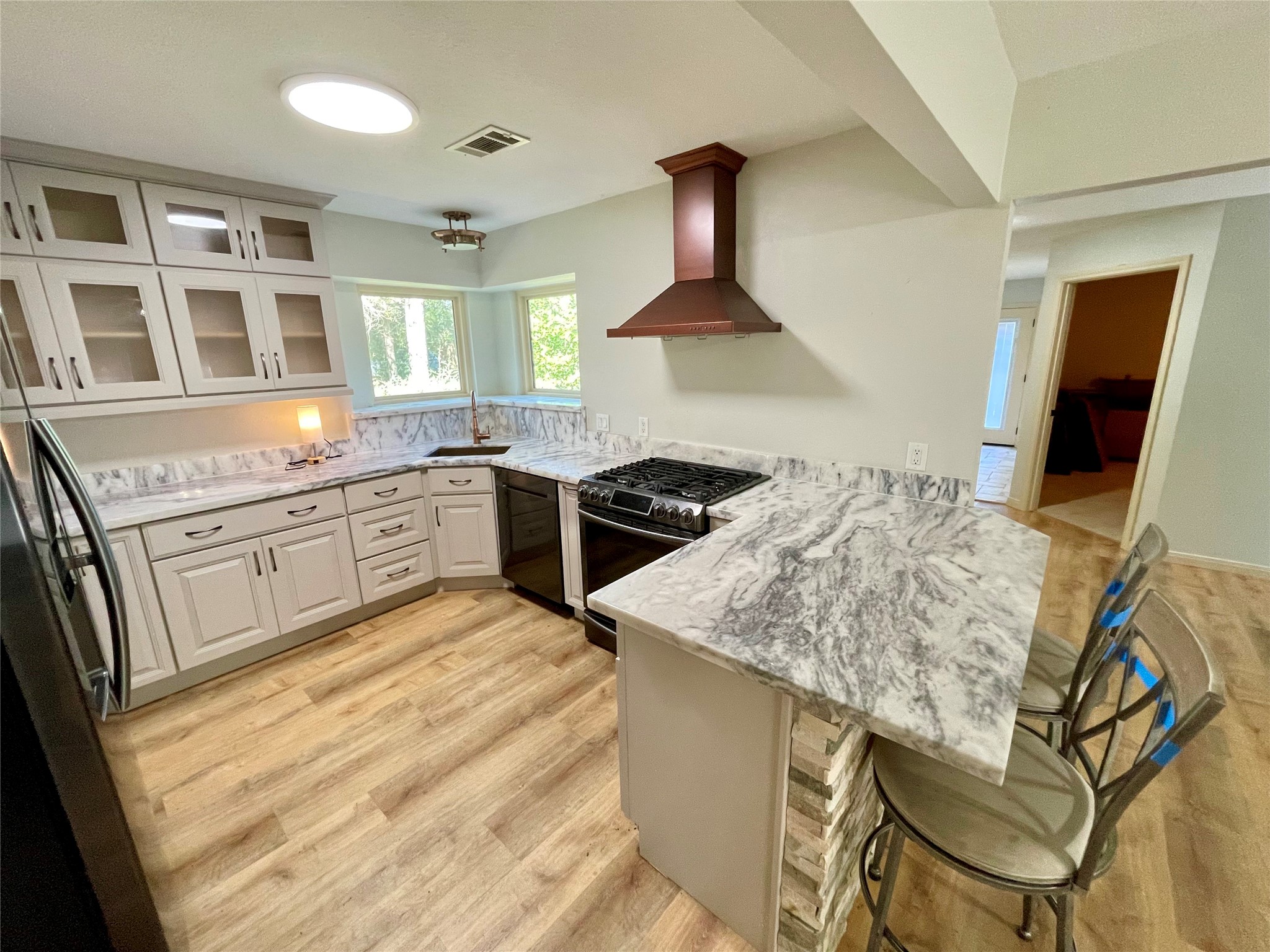 216 Woerner Road Houston, TX 77090 - Photo 18 of 33 a kitchen with stainless steel appliances granite countertop a sink stove and refrigerator