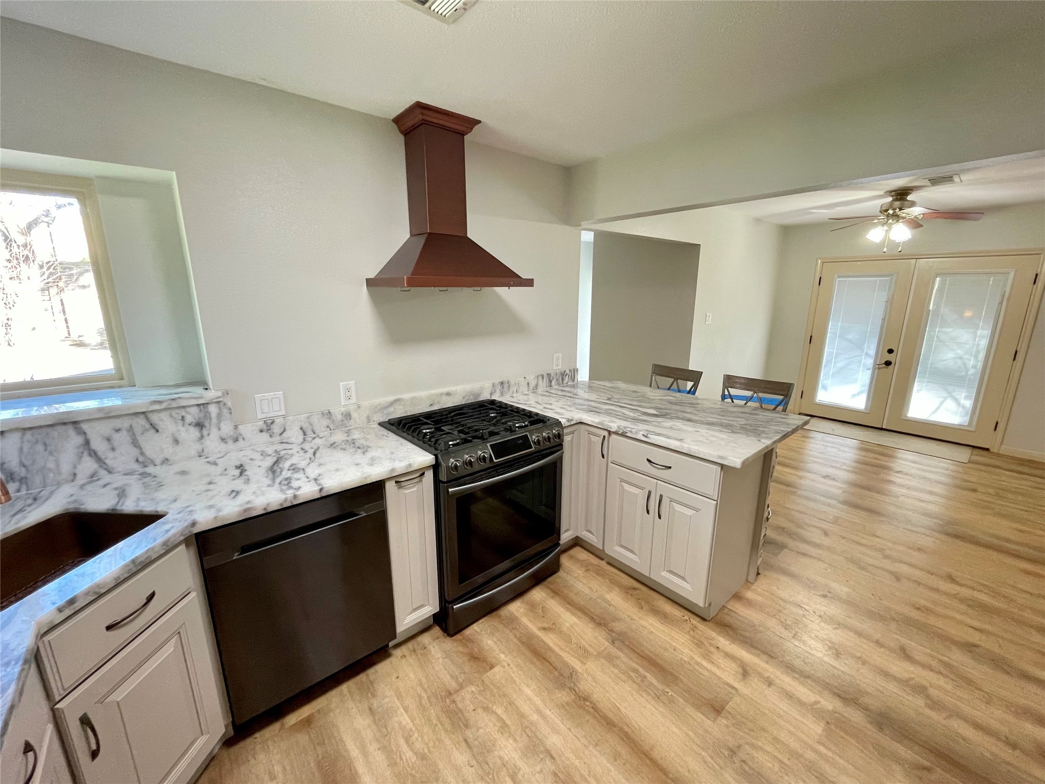 216 Woerner Road Houston, TX 77090 - Photo 19 of 33 a kitchen with stainless steel appliances granite countertop a sink stove and cabinets