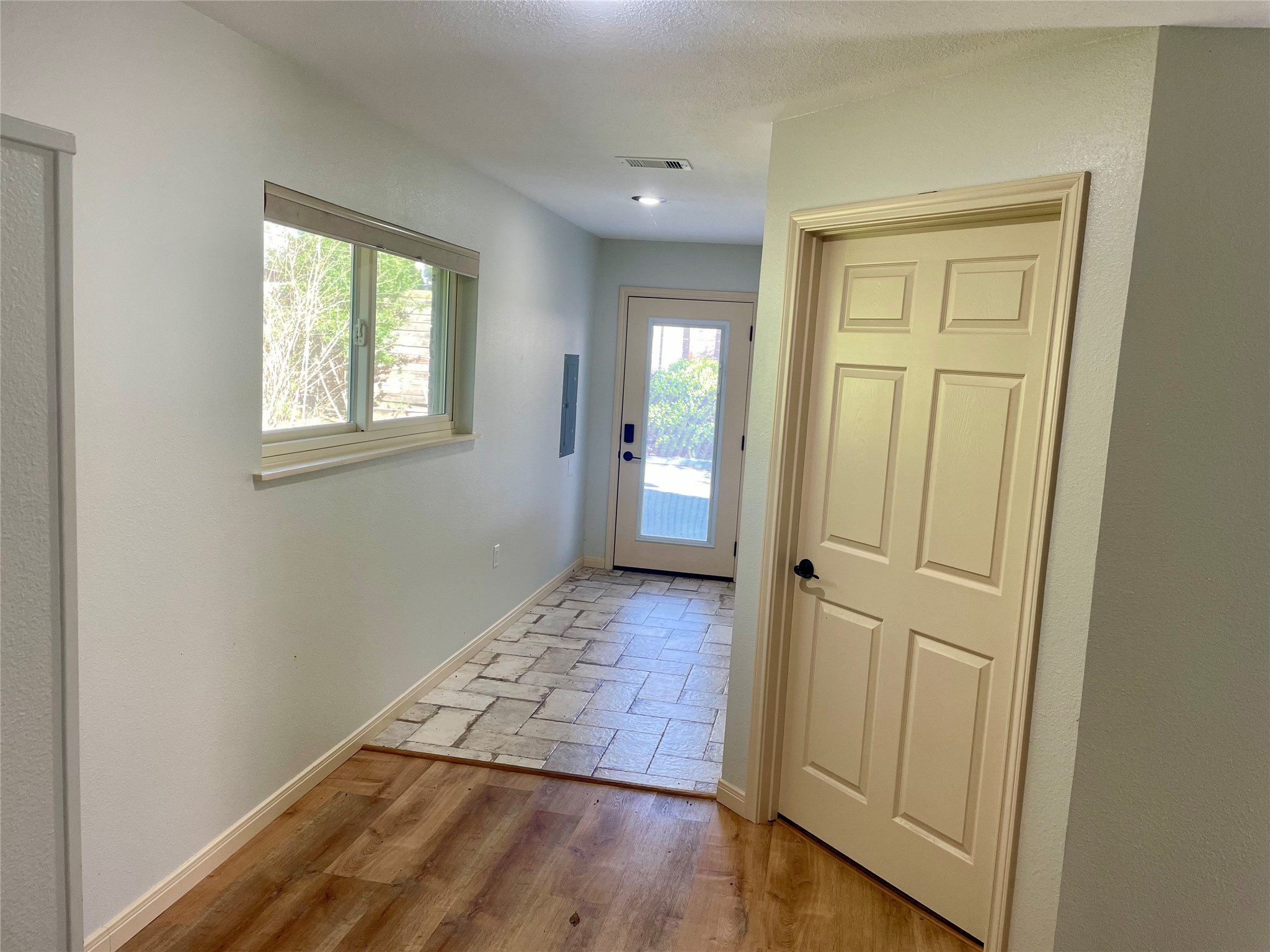 216 Woerner Road Houston, TX 77090 - Photo 21 of 33 an empty room with wooden floor and a window
