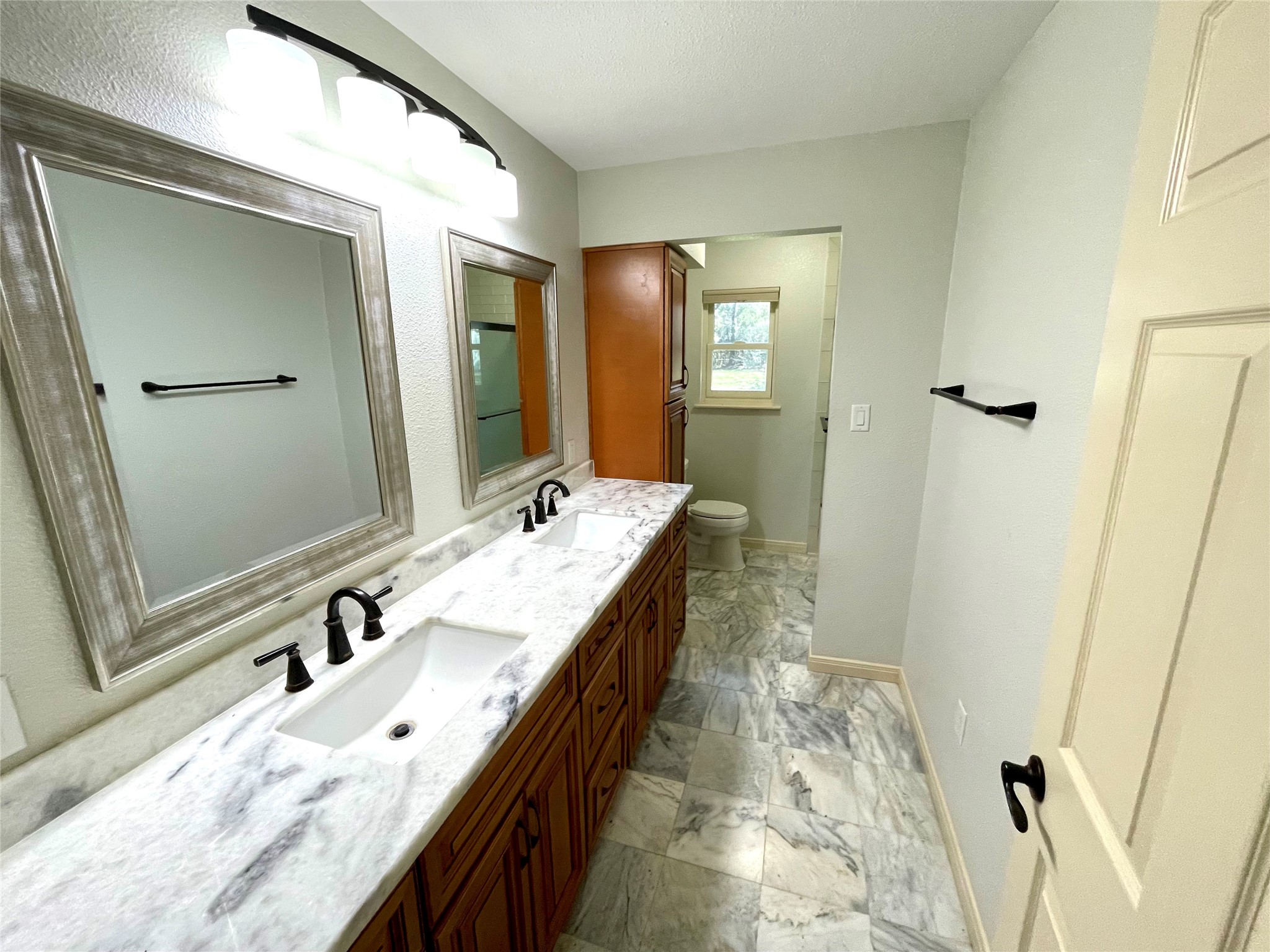 216 Woerner Road Houston, TX 77090 - Photo 23 of 33 a bathroom with a tub sink and mirror