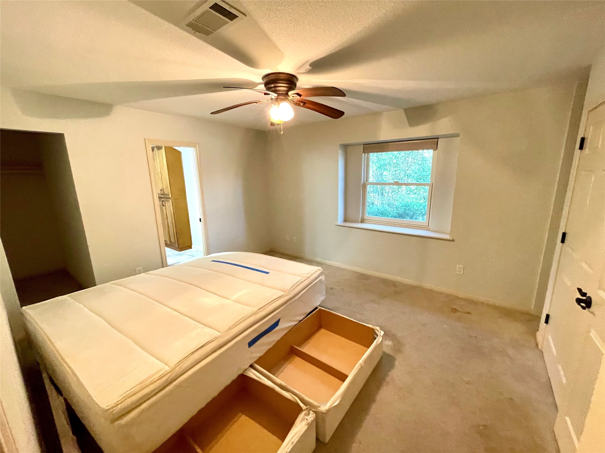216 Woerner Road Houston, TX 77090 - Photo 24 of 33 a bedroom with a bed and a chandelier