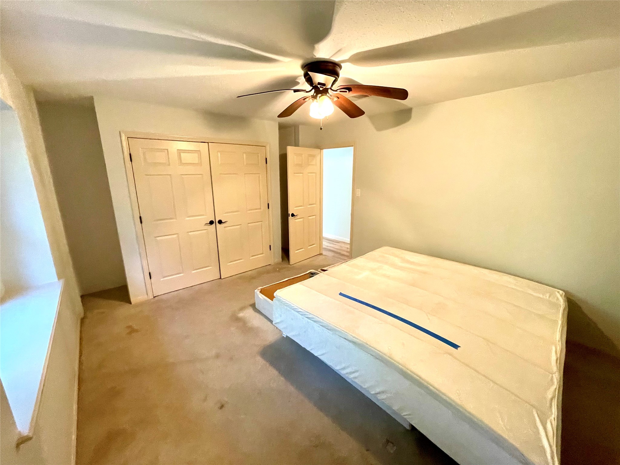 216 Woerner Road Houston, TX 77090 - Photo 26 of 33 a bedroom with a bed and a chandelier