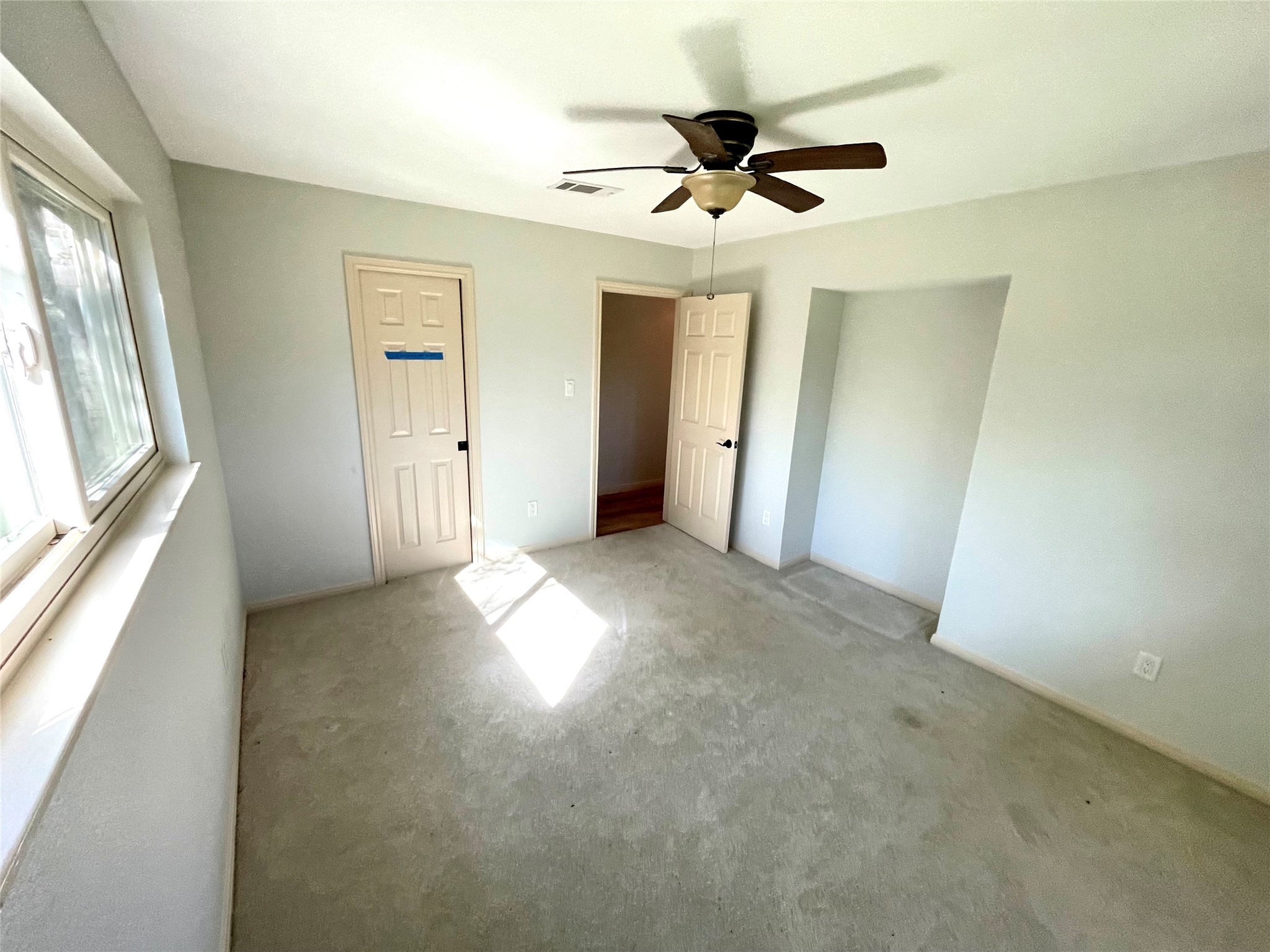 216 Woerner Road Houston, TX 77090 - Photo 28 of 33 a view of a livingroom with a ceiling fan and window