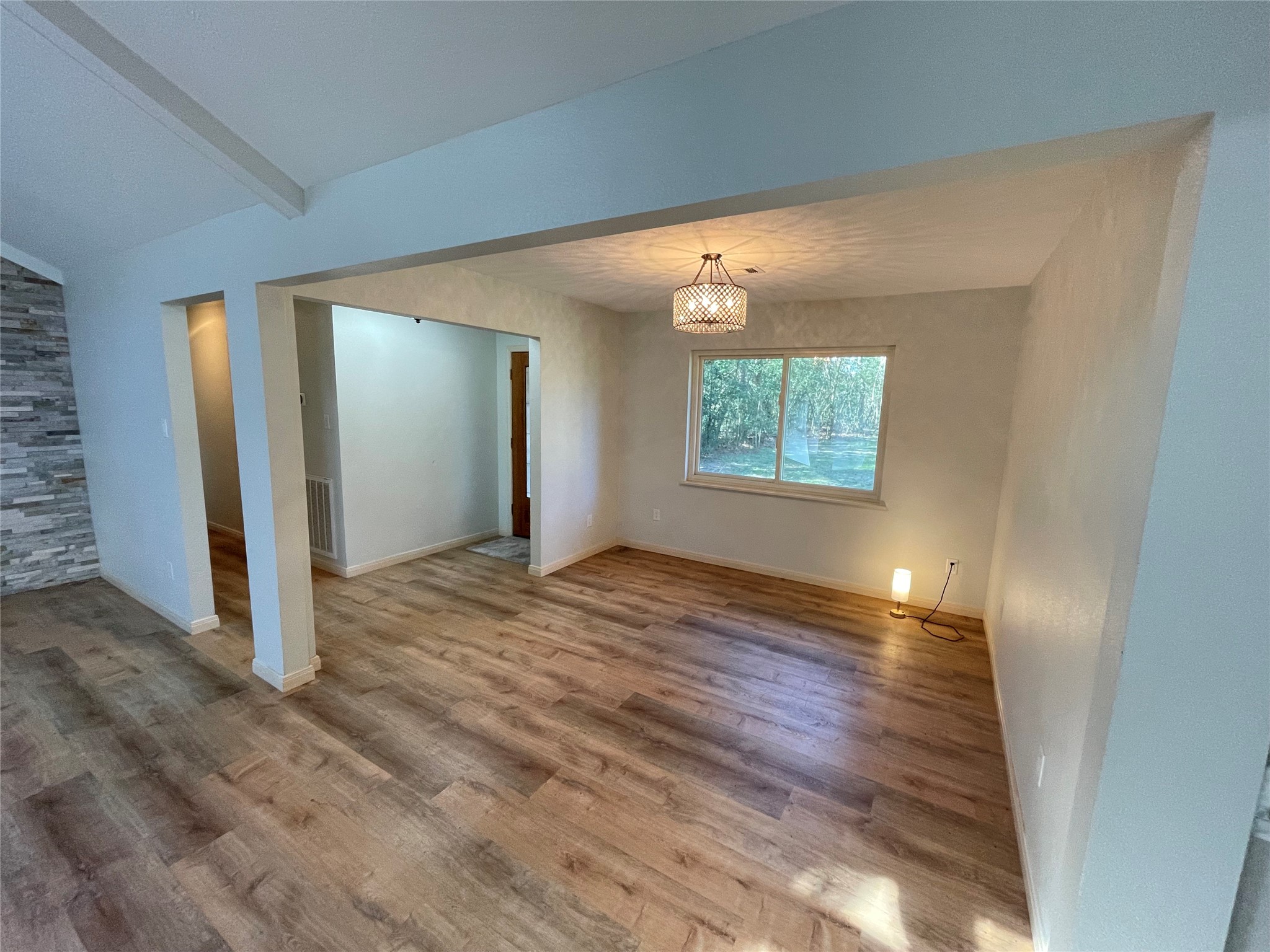 216 Woerner Road Houston, TX 77090 - Photo 5 of 33 a view of a room with wooden floor and window