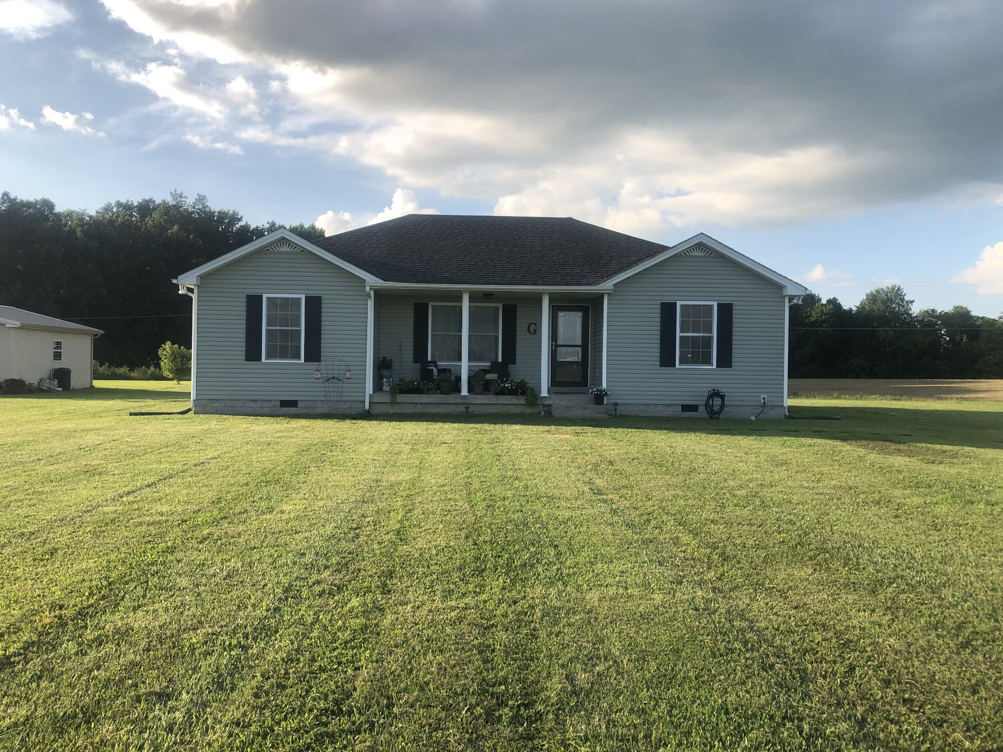 1895 Days Road Lafayette, TN 37083 - Photo 1 of 13 a front view of house with yard and green space