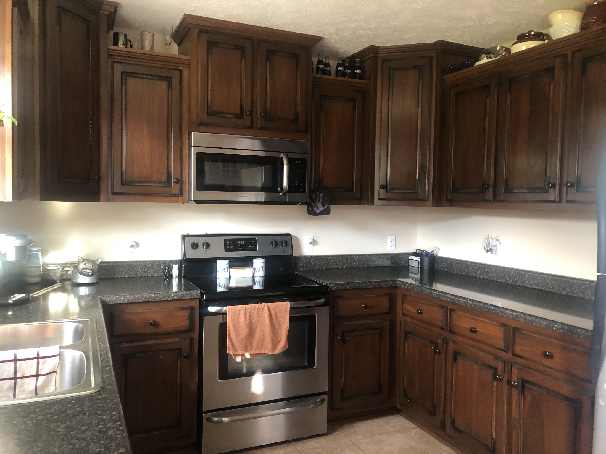 1895 Days Road Lafayette, TN 37083 - Photo 4 of 13 a kitchen with granite countertop a refrigerator stove and microwave