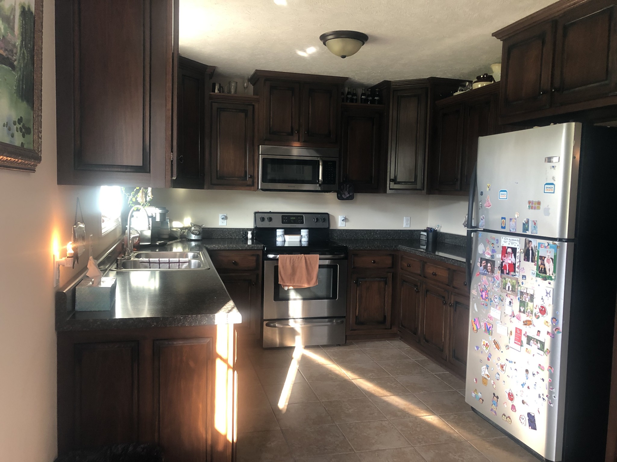 1895 Days Road Lafayette, TN 37083 - Photo 5 of 13 a kitchen with stainless steel appliances granite countertop a refrigerator a sink dishwasher a stove and a microwave oven on granite countertops
