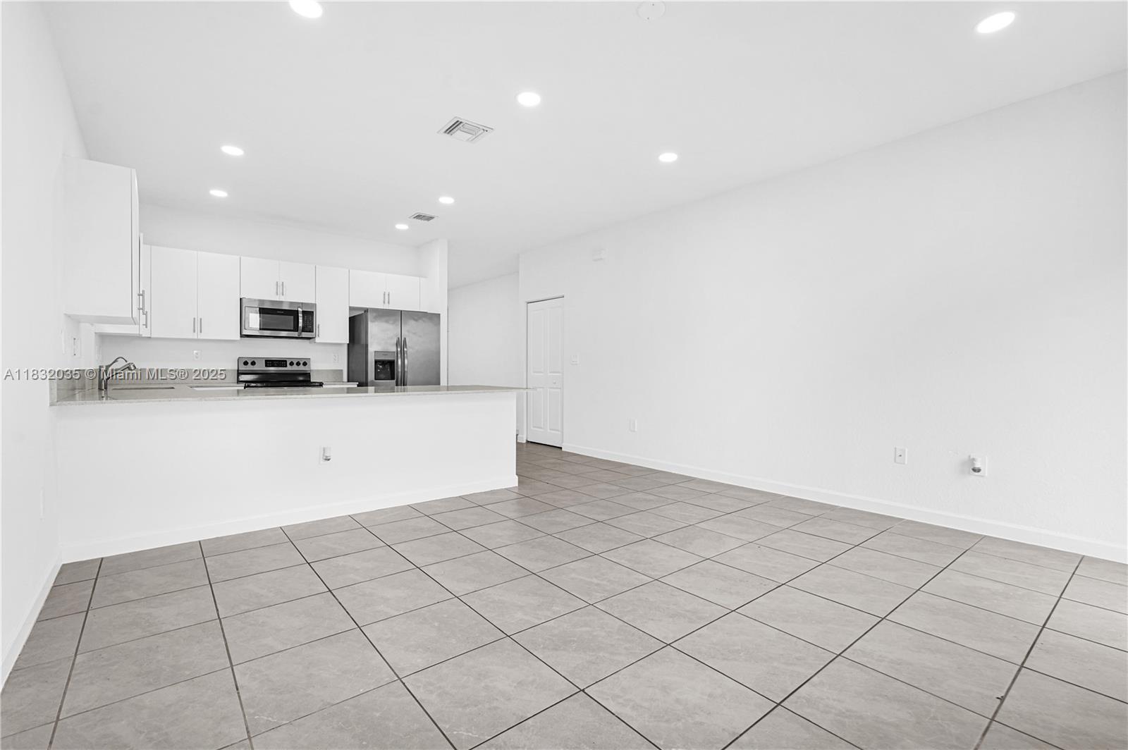 12735 Southwest 211th Street, Unit 12735 Miami, FL 33177 - Photo 32 of 45 a view of a kitchen with an oven and cabinets