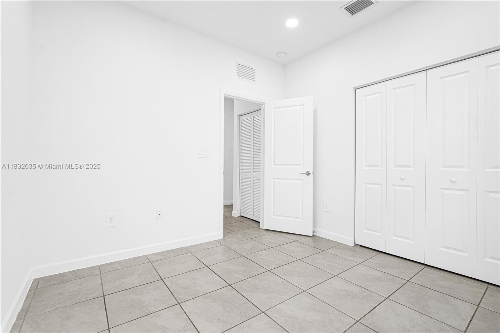 12735 Southwest 211th Street, Unit 12735 Miami, FL 33177 - Photo 36 of 45 a view of an empty room