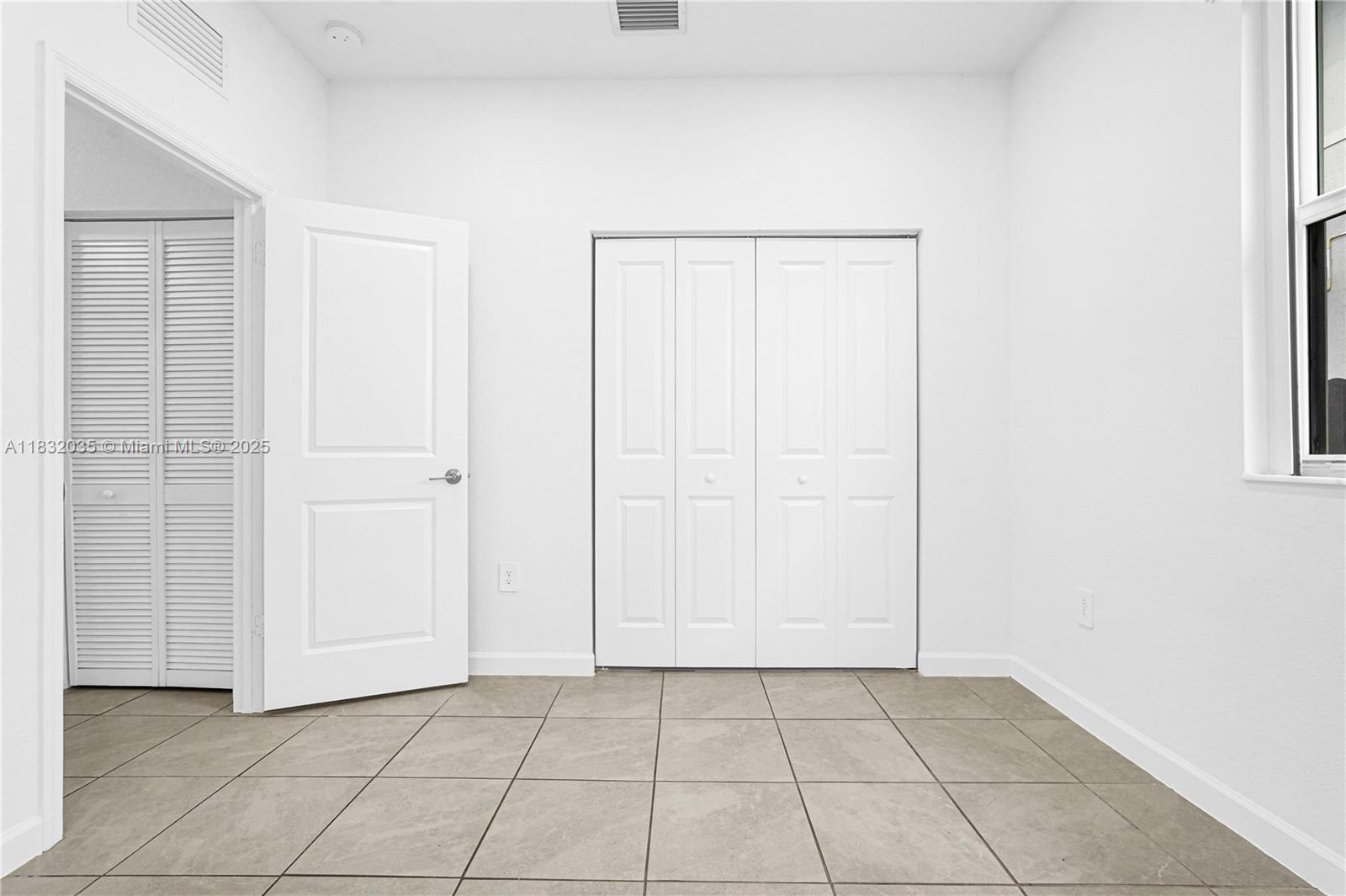 12735 Southwest 211th Street, Unit 12735 Miami, FL 33177 - Photo 37 of 45 an empty room with cabinet