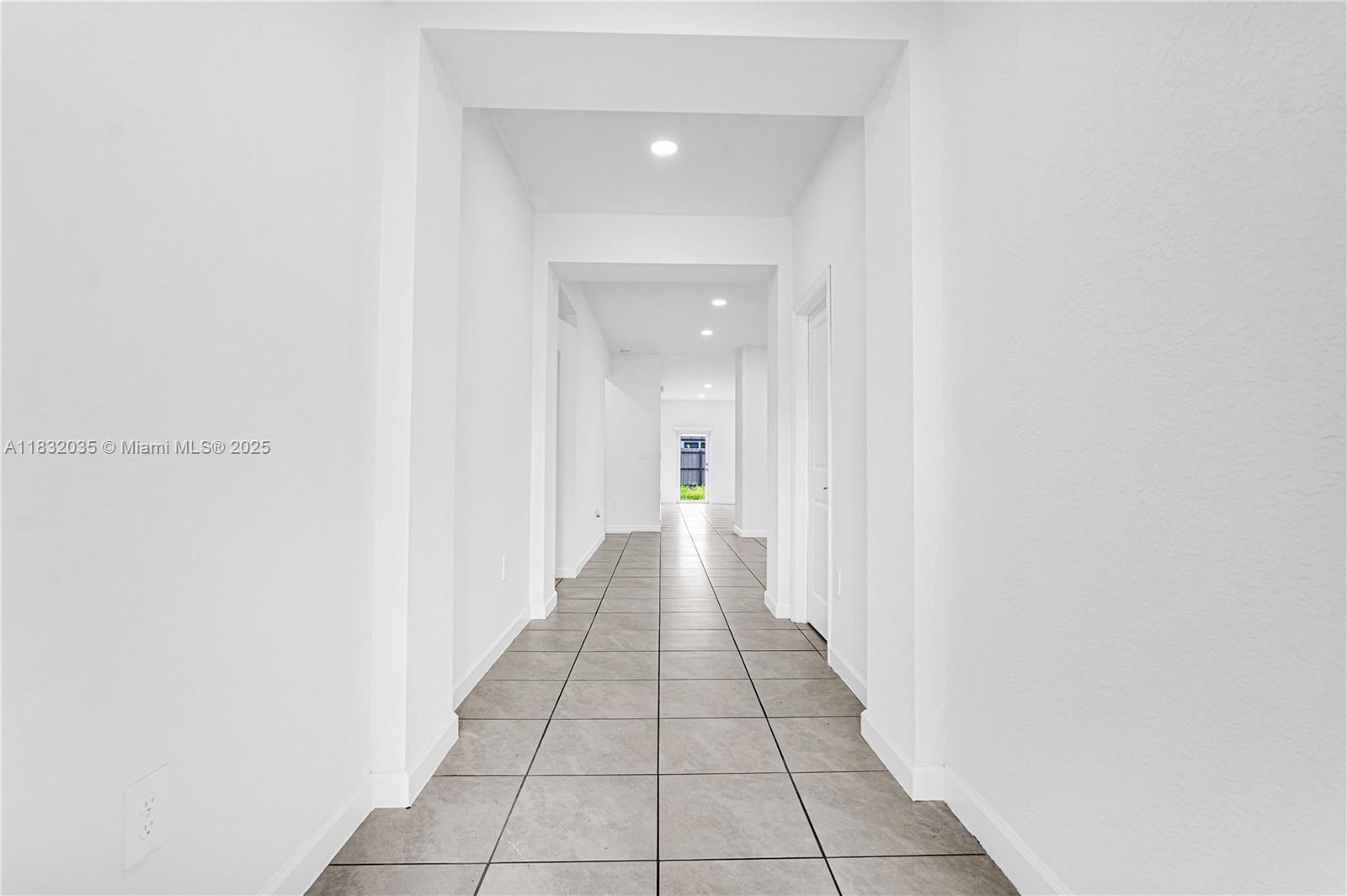 12735 Southwest 211th Street, Unit 12735 Miami, FL 33177 - Photo 38 of 45 a view of a hallway with a white walls
