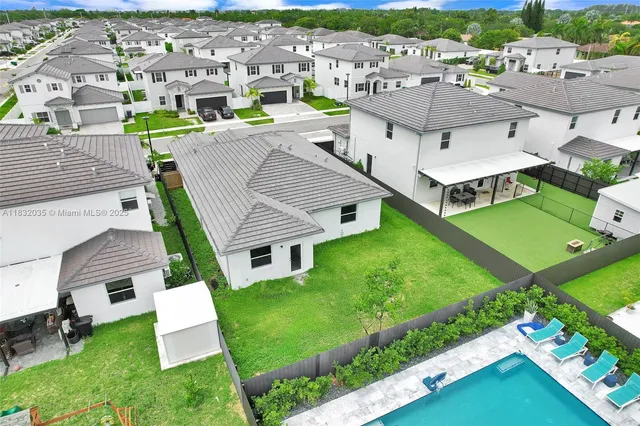 an aerial view of a house with a garden