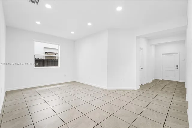 a kitchen with white cabinets stainless steel appliances and a sink