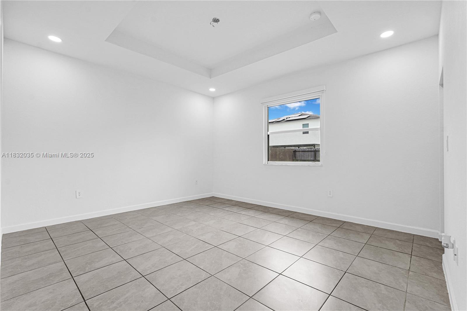 12735 Southwest 211th Street, Unit 12735 Miami, FL 33177 - Photo 9 of 45 an empty room with windows and cabinet