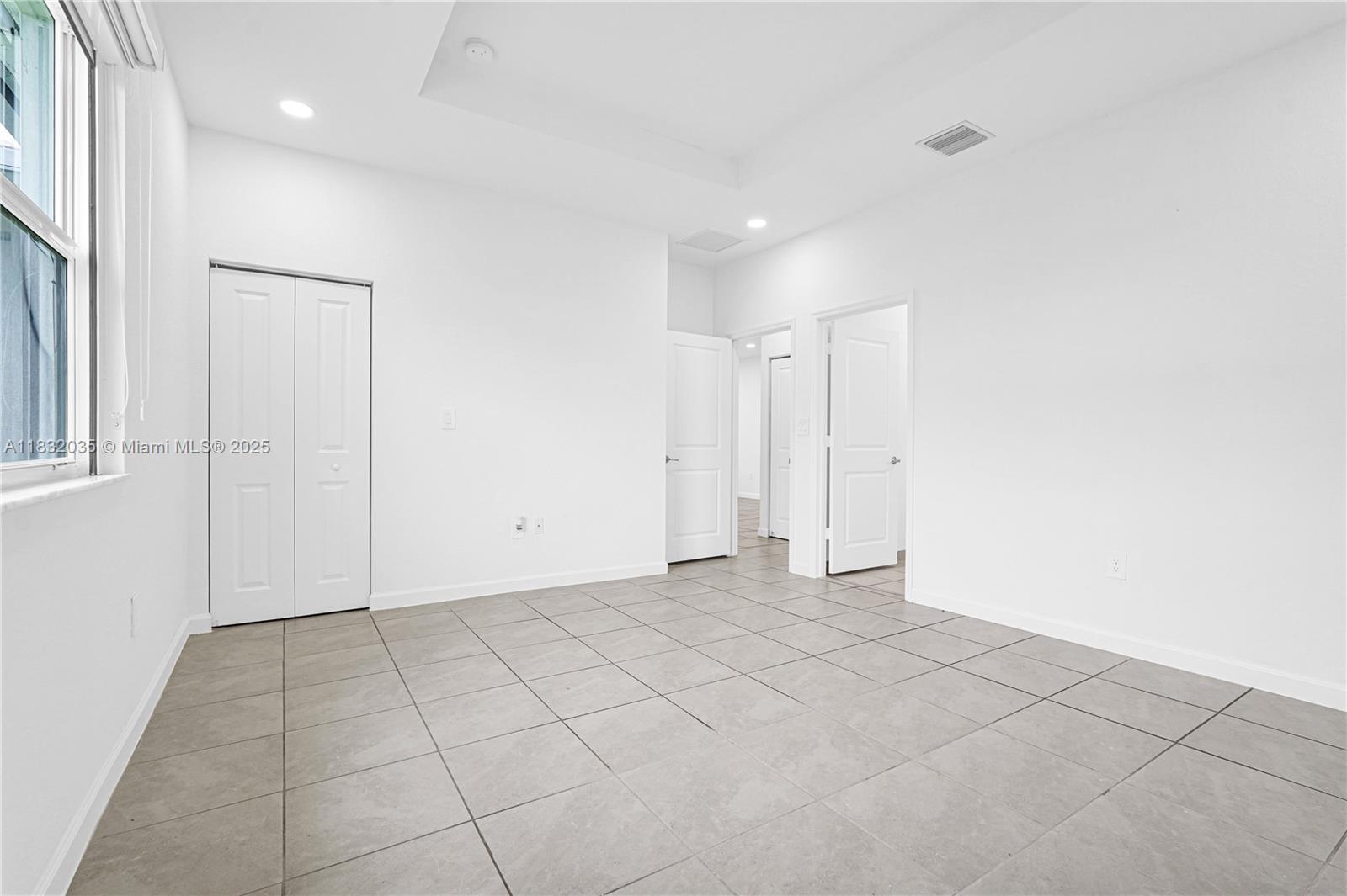 12735 Southwest 211th Street, Unit 12735 Miami, FL 33177 - Photo 10 of 45 a view of an empty room