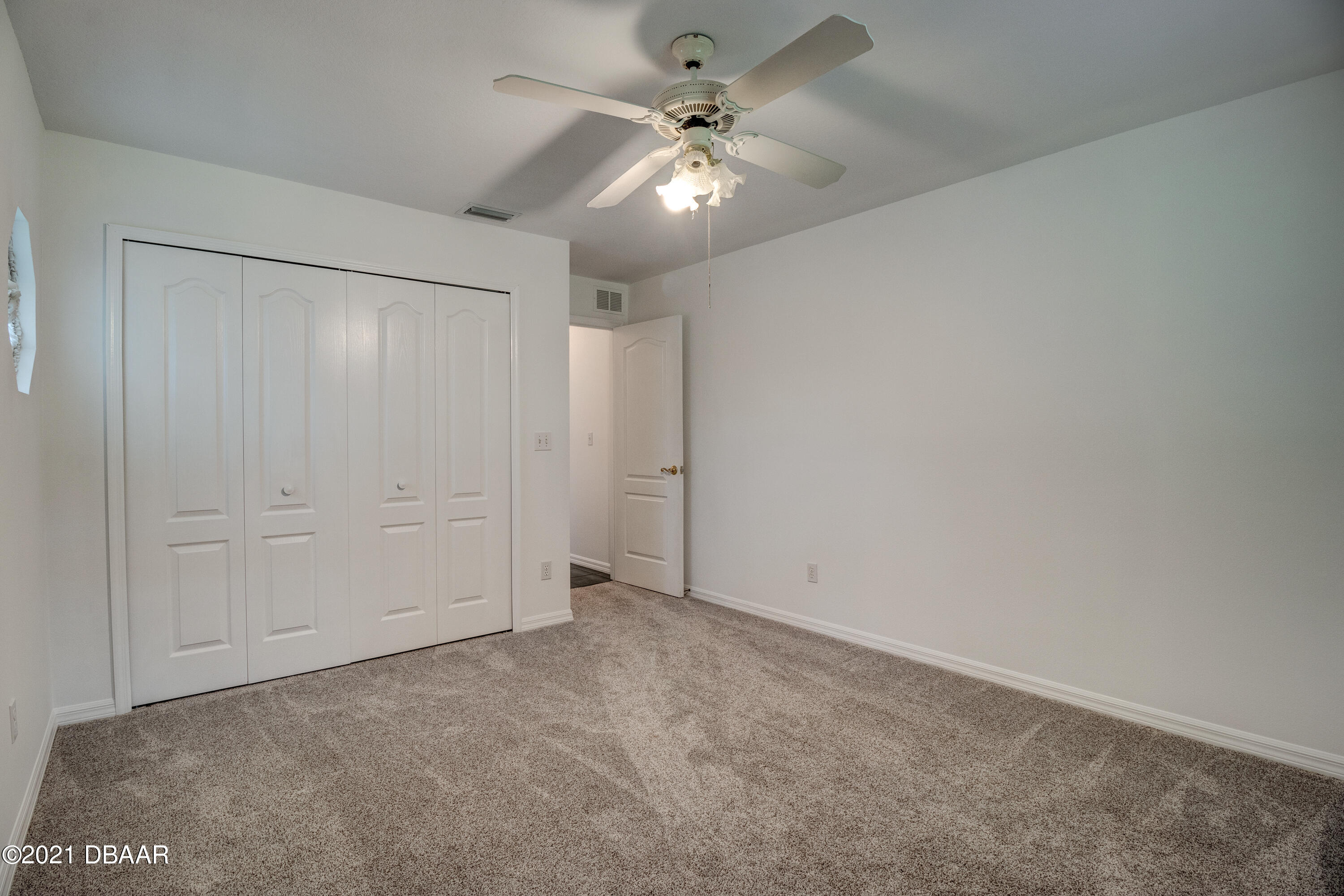 2 Hunt Master Court Ormond Beach, FL 32174 - Photo 25 of 31 an empty room with chandelier fan