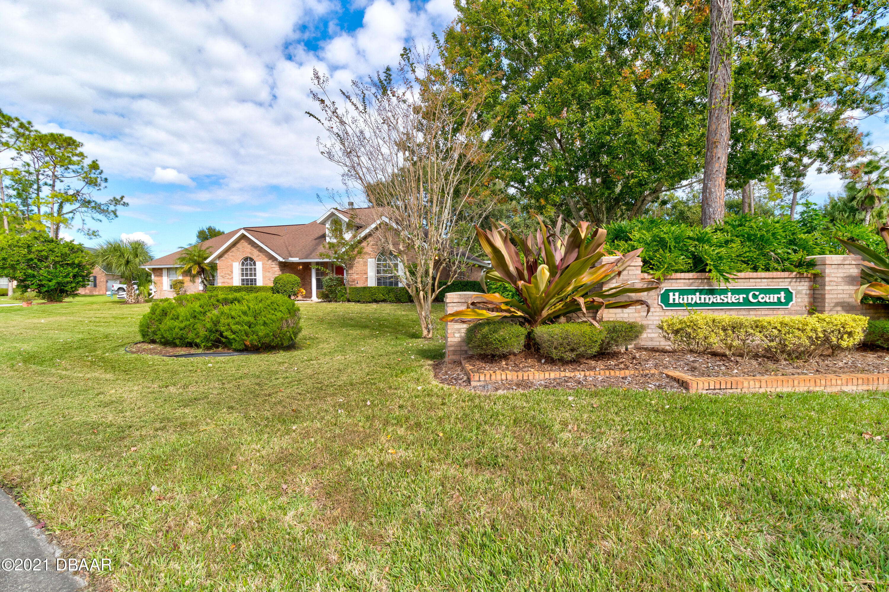 2 Hunt Master Court Ormond Beach, FL 32174 - Photo 3 of 31 a view of a garden with a bench