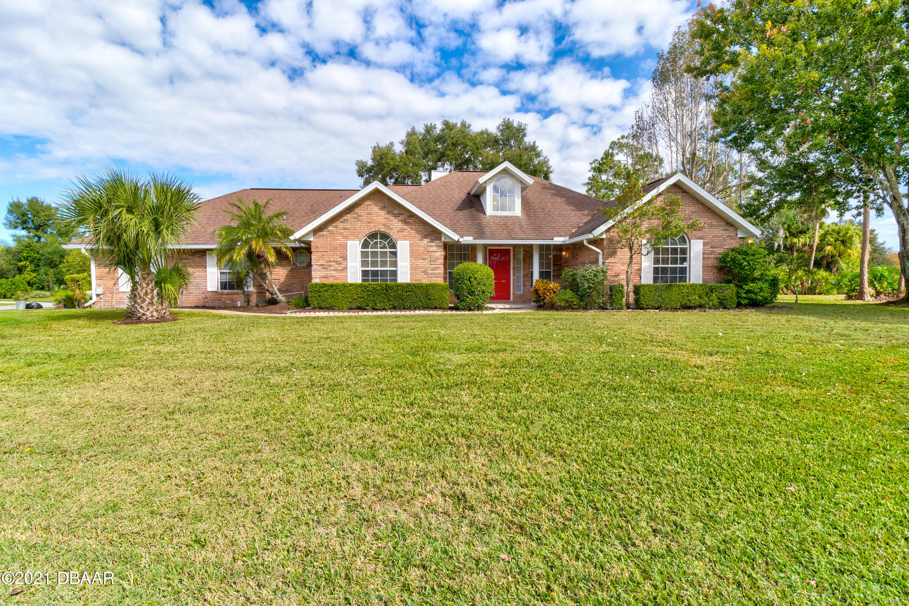 2 Hunt Master Court Ormond Beach, FL 32174 - Photo 4 of 31 a view of a house with a big yard and large trees