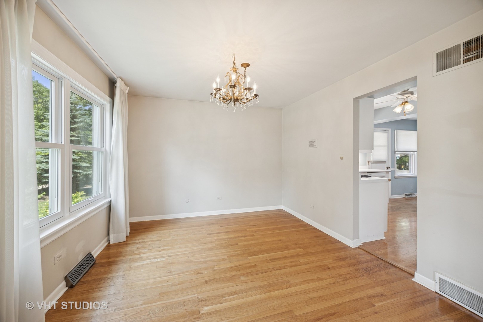 125 Barrypoint Road Riverside, IL 60546 - Photo 11 of 30 wooden floor in an empty room with a window