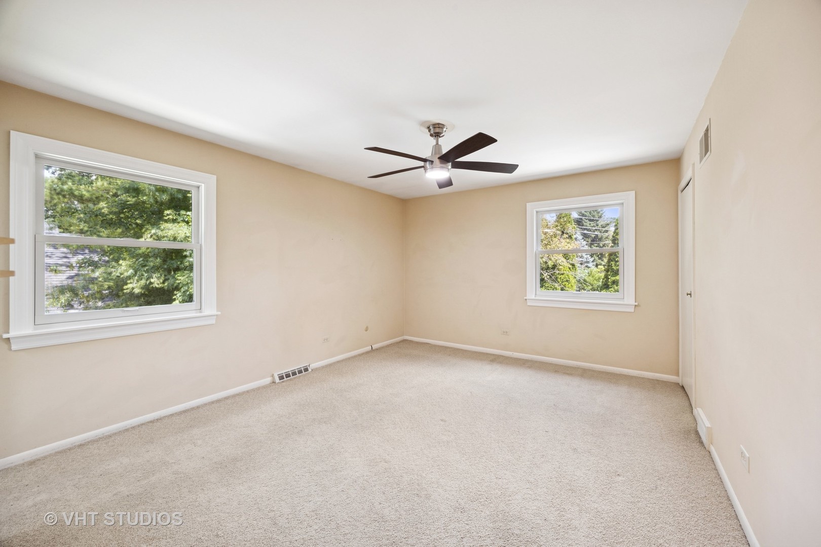 125 Barrypoint Road Riverside, IL 60546 - Photo 12 of 30 an empty room with windows and ceiling fan
