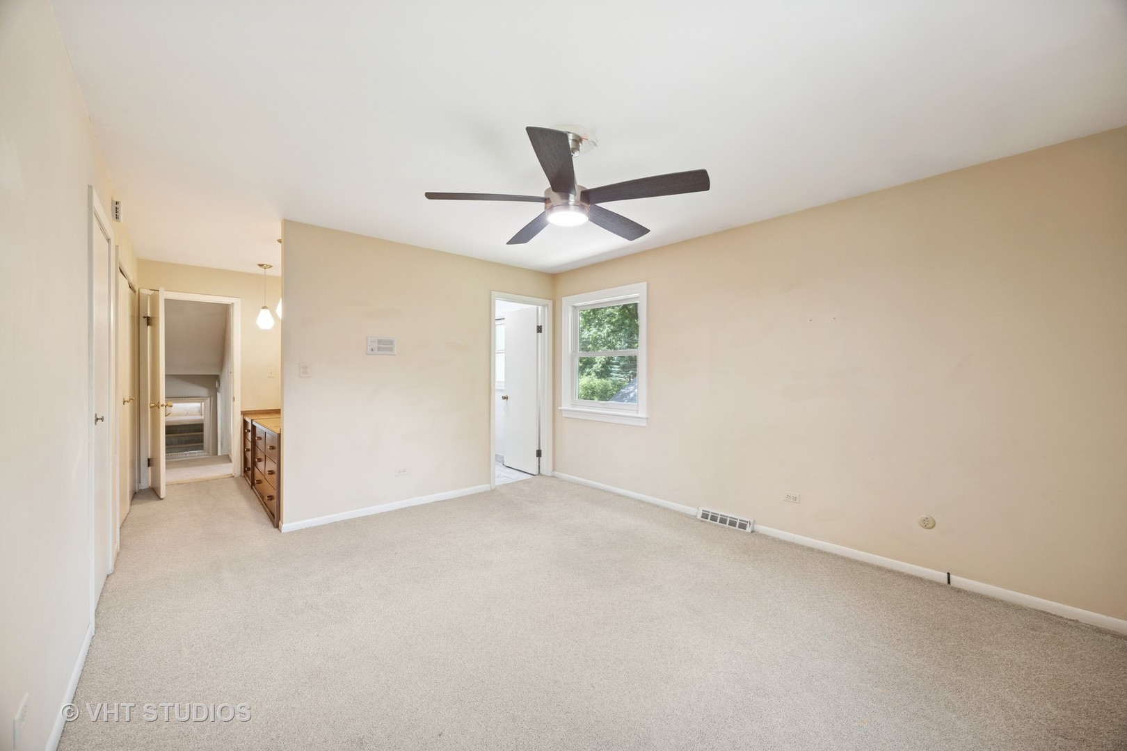 125 Barrypoint Road Riverside, IL 60546 - Photo 13 of 30 a view of a livingroom with a window and a ceiling fan