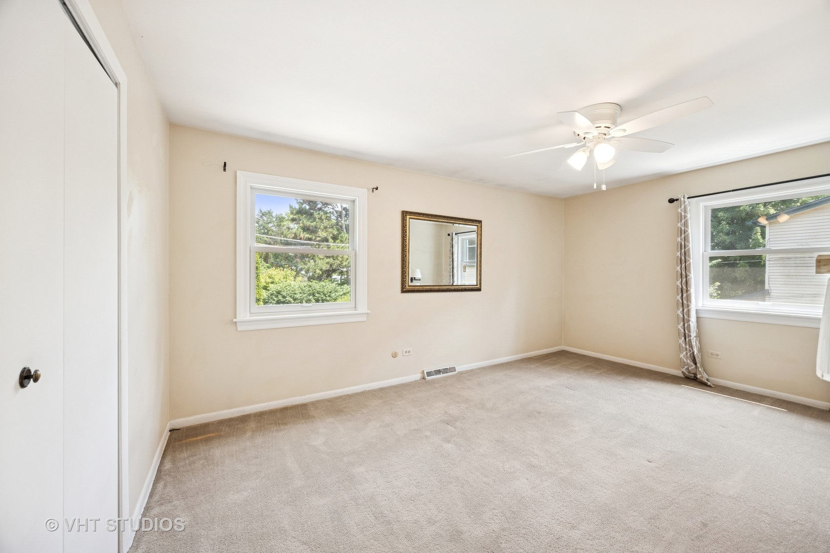 125 Barrypoint Road Riverside, IL 60546 - Photo 15 of 30 an empty room with windows and fan