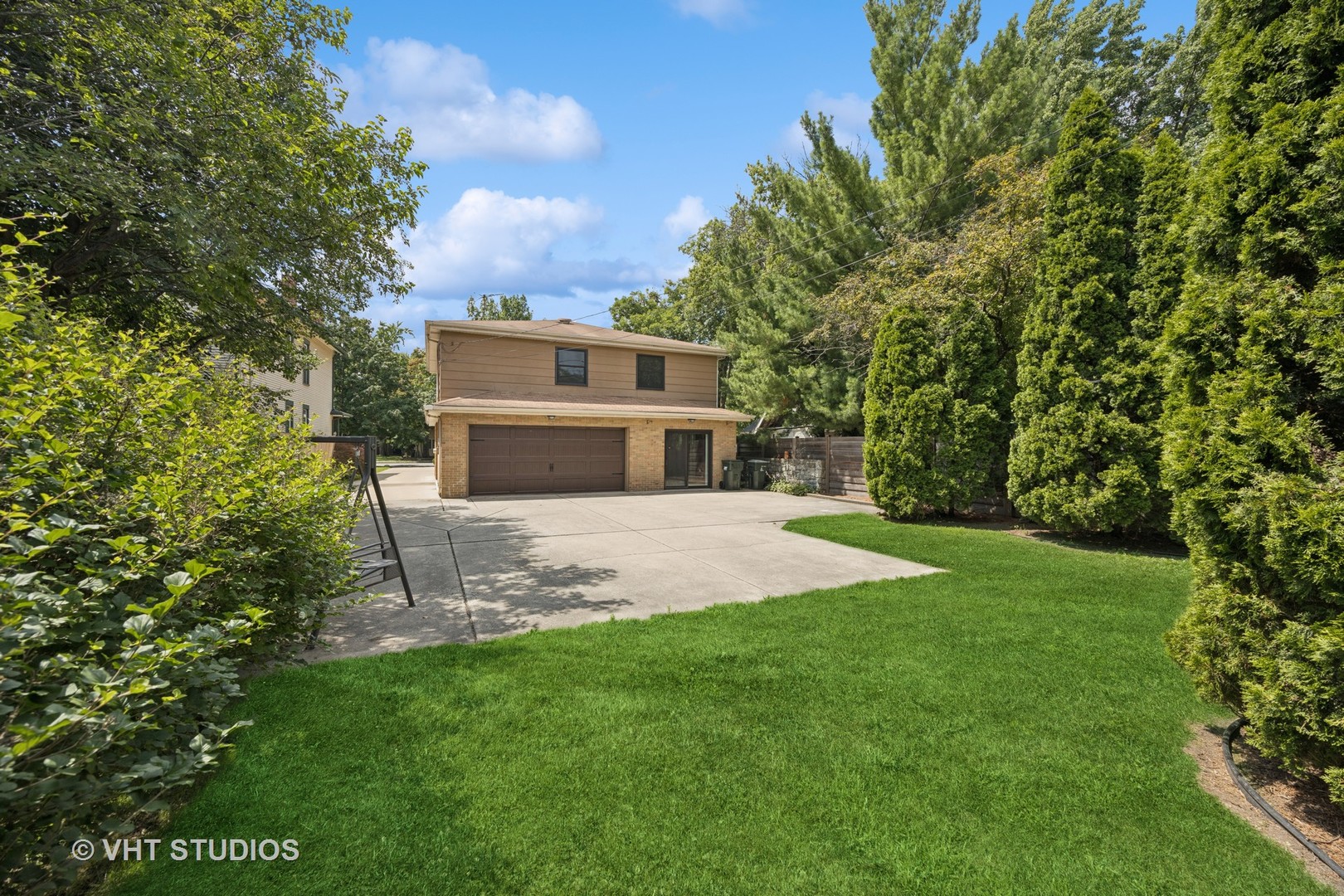 125 Barrypoint Road Riverside, IL 60546 - Photo 25 of 30 a front view of a house with a yard and trees
