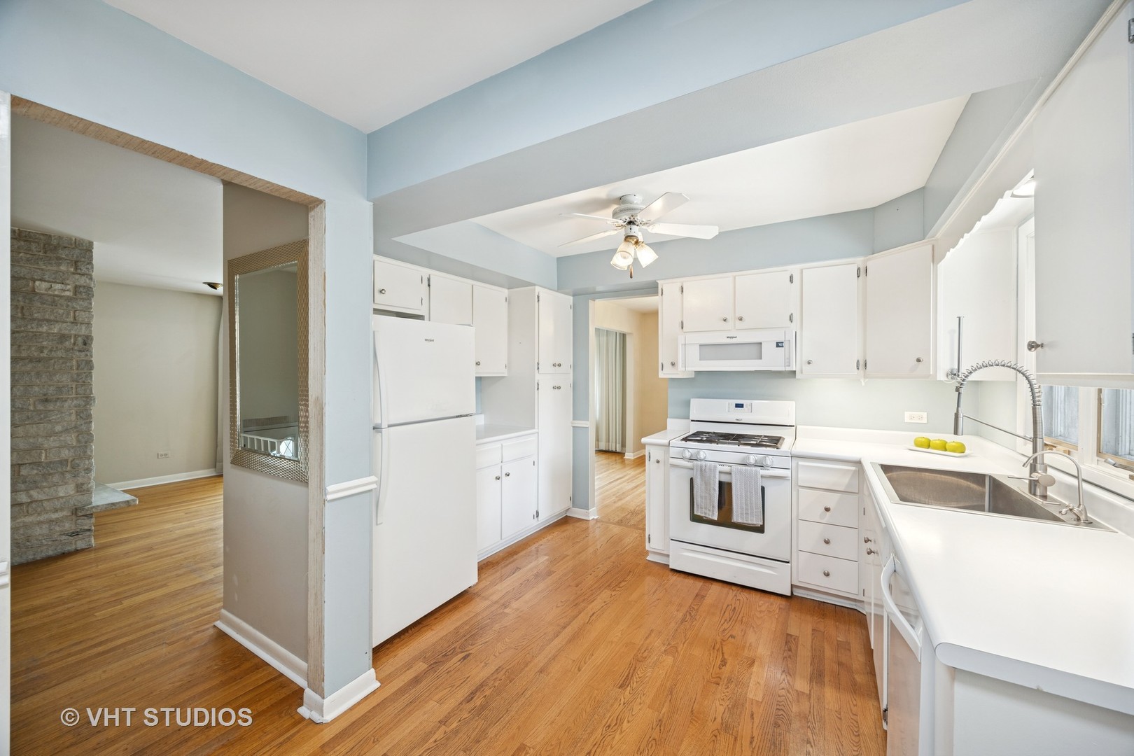 125 Barrypoint Road Riverside, IL 60546 - Photo 5 of 30 a kitchen with white cabinets and stainless steel appliances