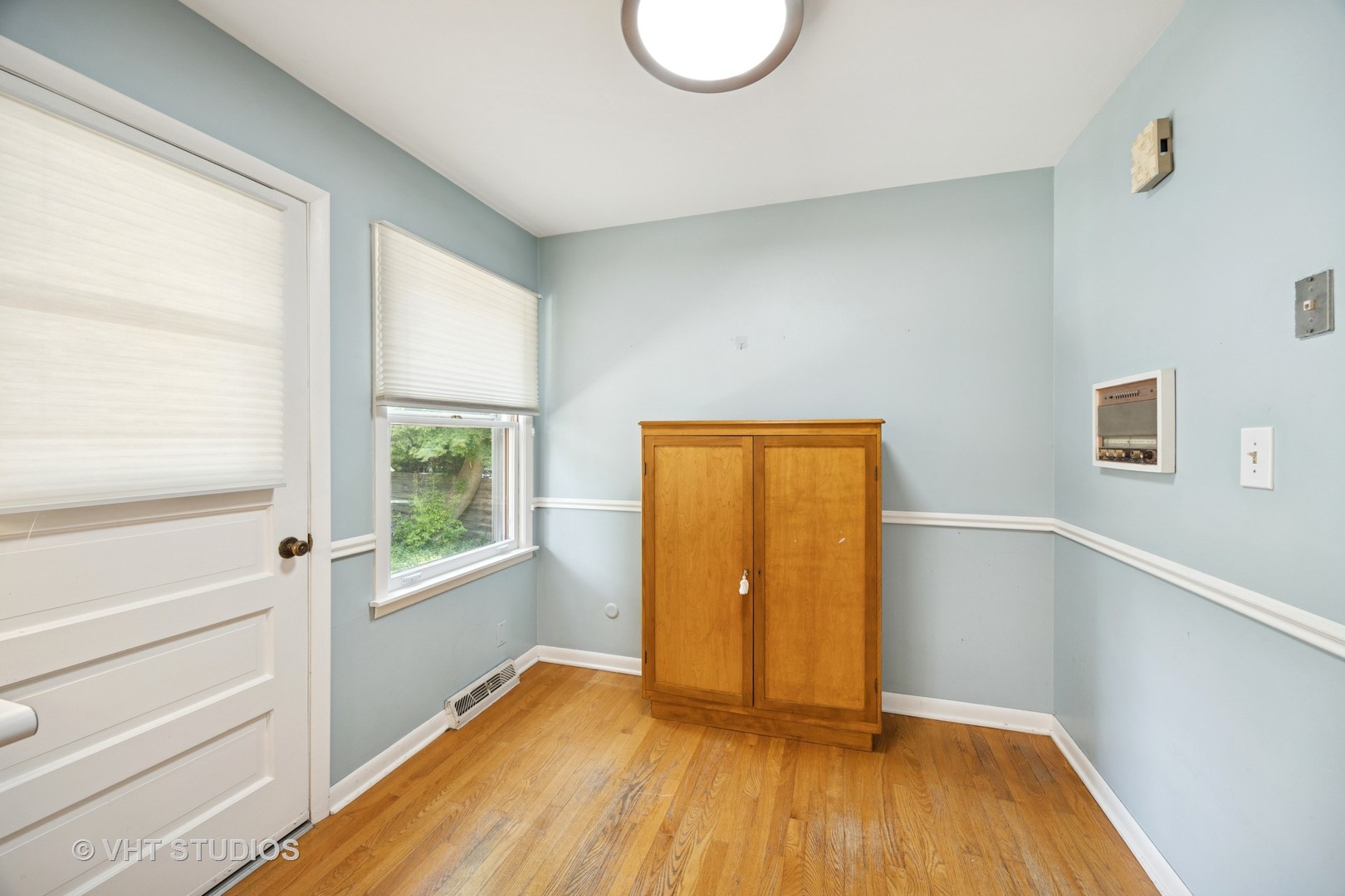 125 Barrypoint Road Riverside, IL 60546 - Photo 6 of 30 a view of an empty room with wooden floor and a window