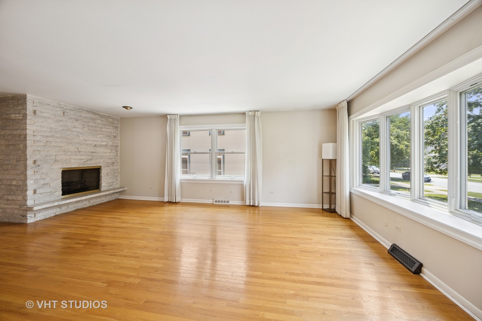 125 Barrypoint Road Riverside, IL 60546 - Photo 9 of 30 a view of an empty room with a fireplace and a window