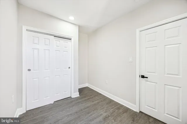 an empty room with wooden floor