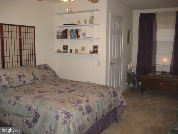 23 Brecht Road Hamilton, NJ 08690 - Photo 11 of 15 a bedroom with a bed and a window