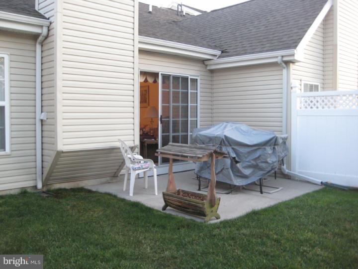 23 Brecht Road Hamilton, NJ 08690 - Photo 14 of 15 a view of a backyard with table and chairs and a barbeque