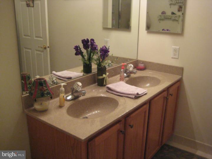 23 Brecht Road Hamilton, NJ 08690 - Photo 9 of 15 a bathroom with a sink and a mirror