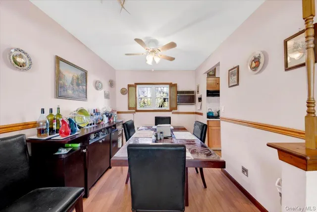 a view of a dining room with furniture and a chandelier