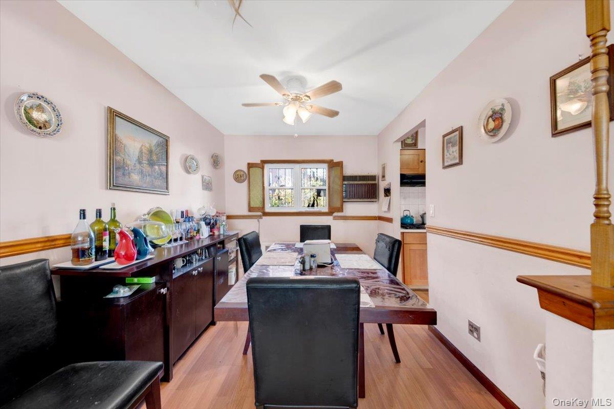 733 Rhinelander Avenue Bronx, NY 10462 - Photo 8 of 31 Office with light wood-style floors, ceiling fan, and a wall mounted AC
