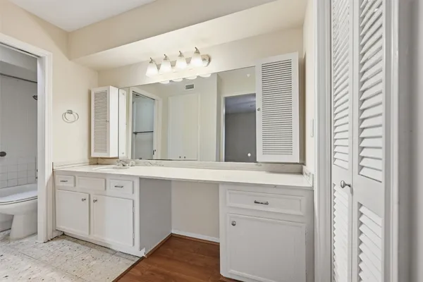 a view of a double sink and a mirror