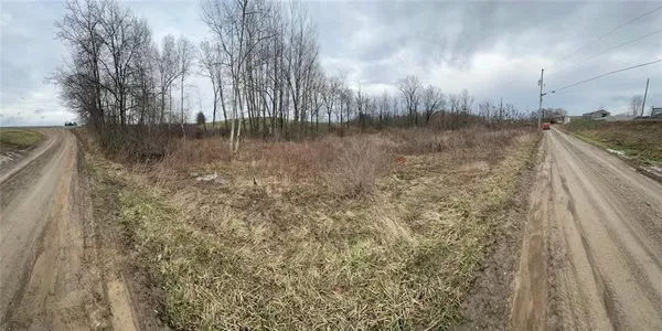 a view of a lake in middle of forest