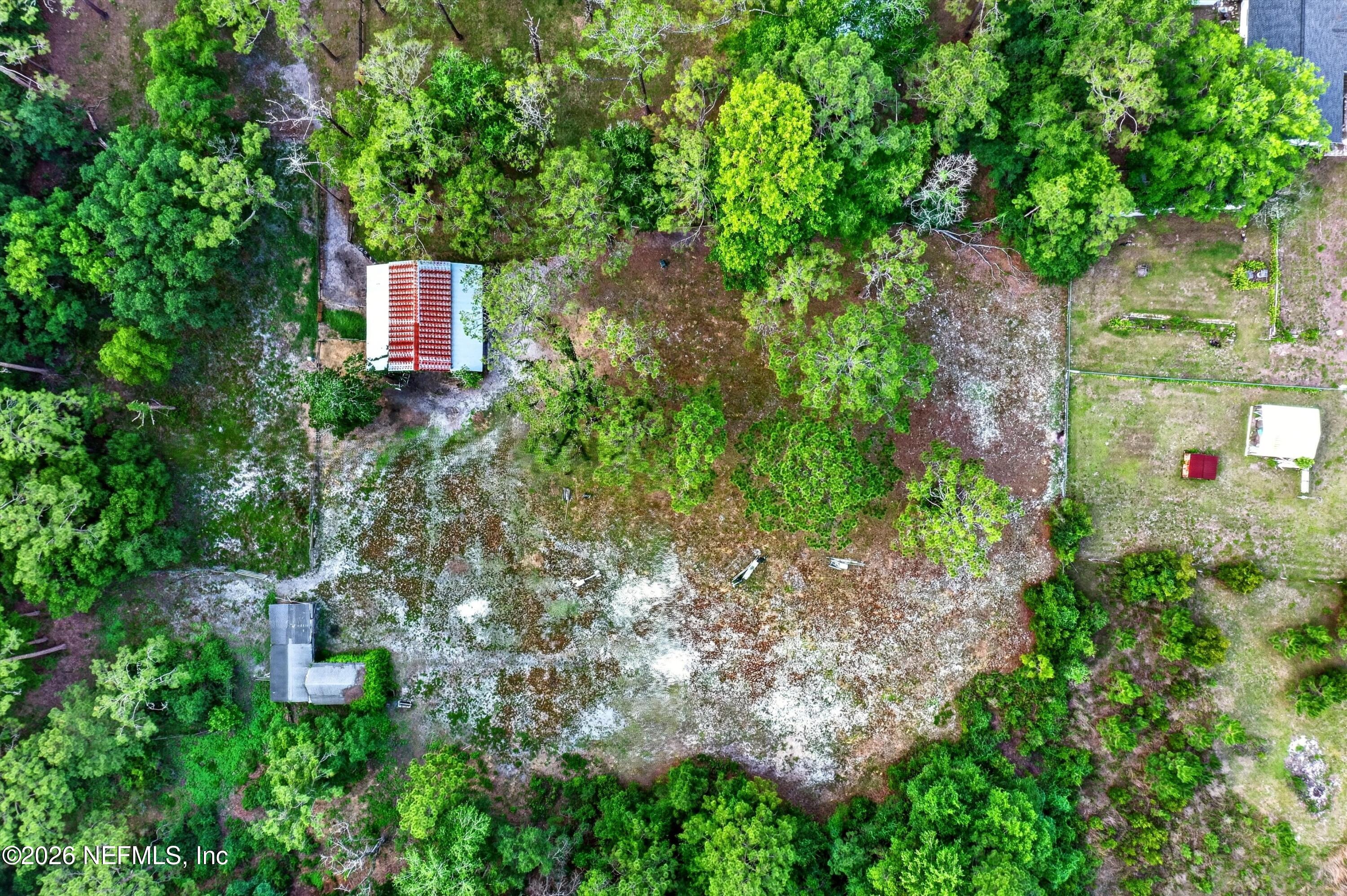 5214 Carter Spencer Road Middleburg, FL 32068 - Photo 34 of 50 an aerial view of a house with a yard and lake view