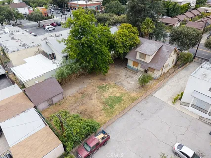 an aerial view of a house with a yard