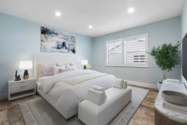 a bedroom with bed and a couch