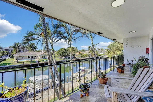 a view of a balcony with outdoor seating