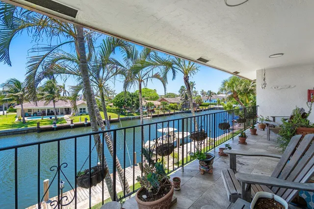 a view of a balcony with outdoor seating