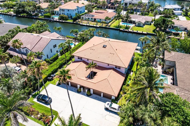 an aerial view of a house with a lake view
