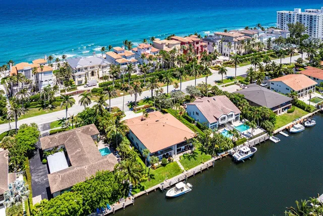 an aerial view of a house with a ocean view