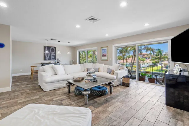 a living room with fireplace furniture and a flat screen tv