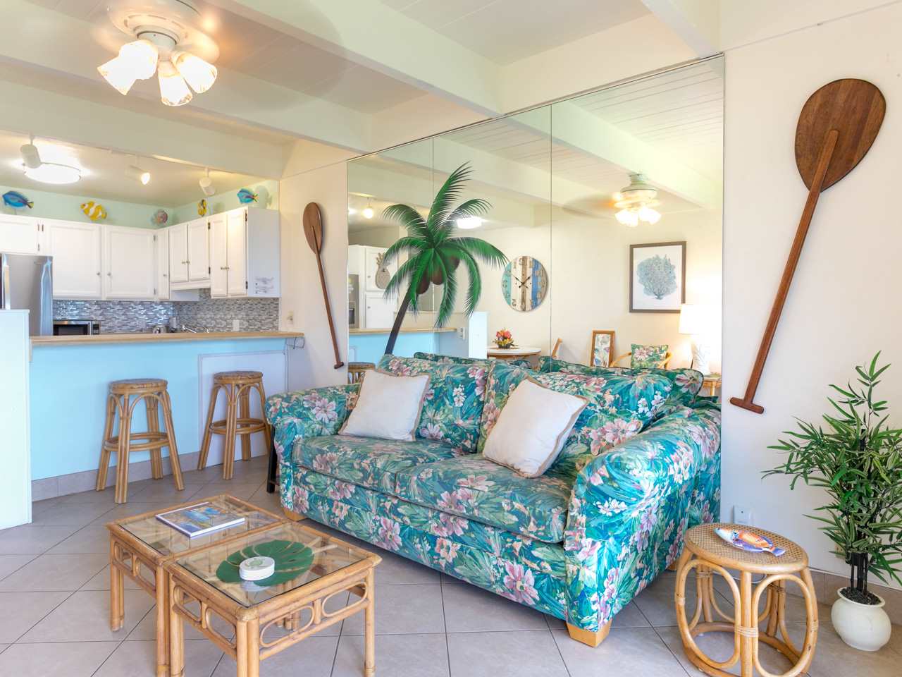 2075 South Kihei Road, Unit 113 Kihei, HI 96753 - Photo 1 of 24 a living room with furniture and a potted plant